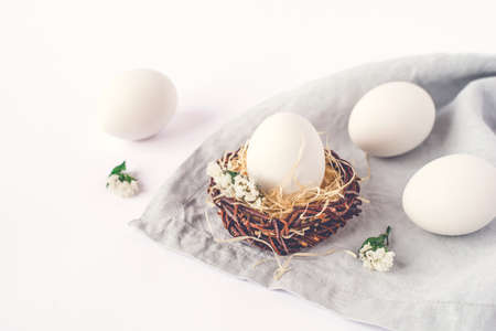 Light Easter background with white Easter eggs.の写真素材