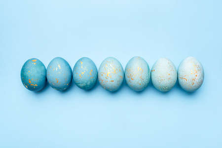 Easter background of eggs painted in blue color. Flat lay, top view.の写真素材
