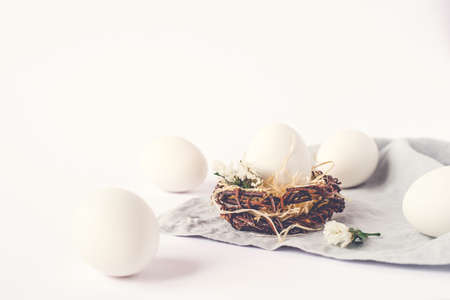 Light Easter background with white Easter eggs.の写真素材