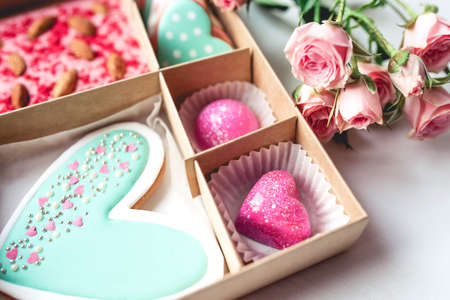 Gift set with hand made sweets in a box on a white table. Flat lay, top view.の写真素材