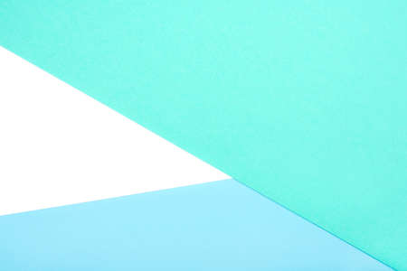 Abstract geometric background of white, green and blue pastel cardboard. Copy space for your text.の写真素材