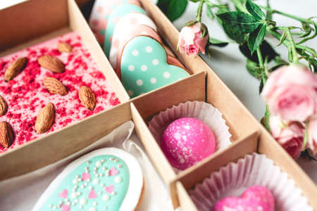Gift set with hand made sweets in a box on a white table. Flat lay, top view.の写真素材