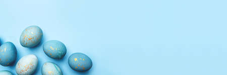 Easter frame of eggs painted in blue color. Flat lay, top view.の写真素材