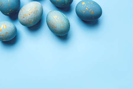 Easter frame of eggs painted in blue color. Flat lay, top view.の写真素材