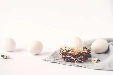 Light Easter background with white Easter eggs.の写真素材