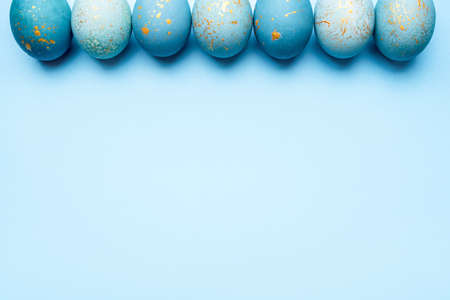 Easter frame of eggs painted in blue color. Flat lay, top view.の写真素材