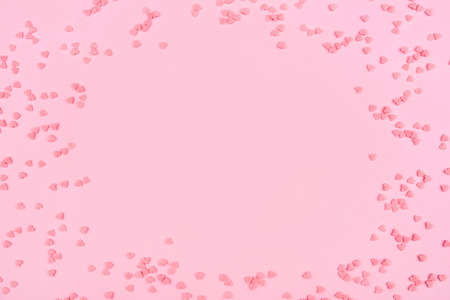 Pink background with tiny hearts. Valentine's day concept. Top view.の写真素材