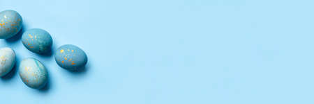 Easter frame of eggs painted in blue color. Flat lay, top view.の写真素材