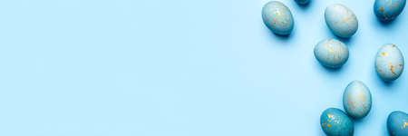 Easter frame of eggs painted in blue color. Flat lay, top view. Copy space for text.の写真素材