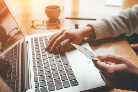 A young woman makes an online payment for a purchase. Online shopping.の写真素材