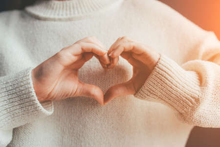 Female hands in the form of heart. Love and care concept.の写真素材