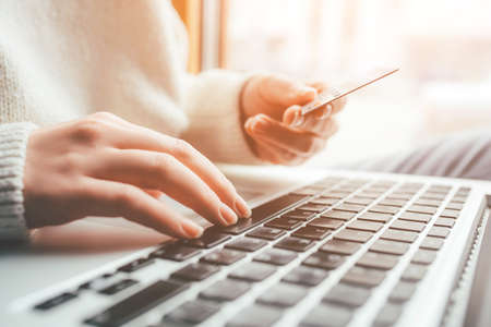 A young woman makes an online payment for a purchase. Online shopping.の写真素材