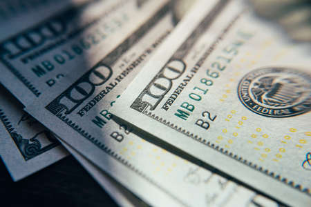American cash dollars close-up. One Hundred Dollar Banknotes. Soft focus image.の写真素材