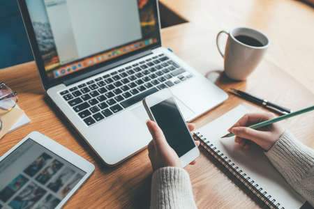 Young woman working in a home office. Remote work concept.の写真素材