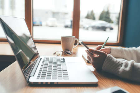 Young woman working remotly. Remote work concept.の写真素材