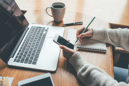 Young woman working in a home office. Remote work concept.の写真素材
