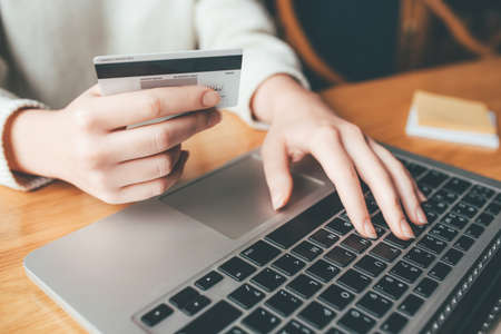 A young woman makes an online payment for a purchase. Online shopping.の写真素材