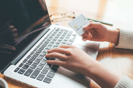A young woman makes an online payment for a purchase. Online shopping.の写真素材