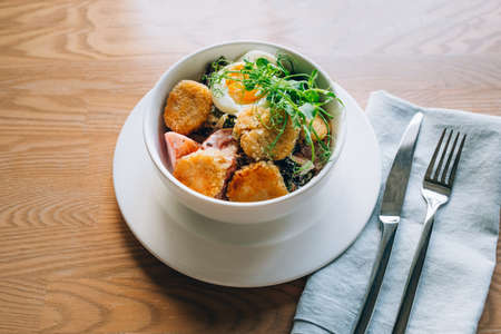 Fresh vegetarian salad in oriental style with falafel.