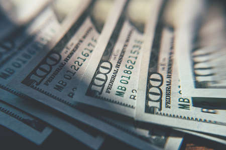 American cash dollars close-up. One Hundred Dollar Banknotes. Soft focus image.の写真素材