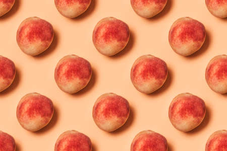 Pattern of peaches on a pastel background. Flat lay, top view.の写真素材