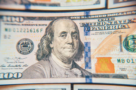 American cash dollars close-up. One Hundred Dollar Banknotes. Soft focus image.の写真素材