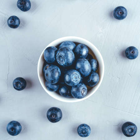 Fresh blueberries in a white bowl. Close up, top view.の写真素材
