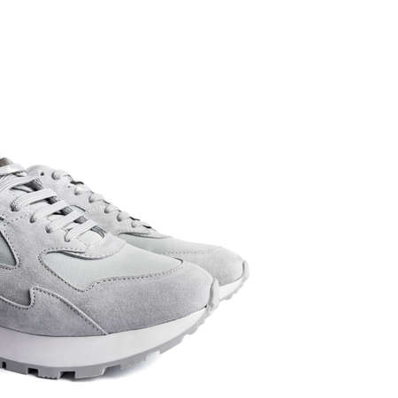 Gray sneakers isolated on white background. Copy space for text.の写真素材