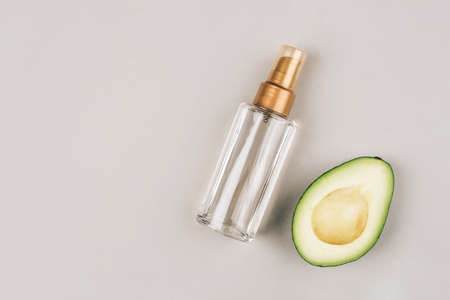 A bottle with a cosmetic product for skin care. Natural ingredients, avocado. The concept of natural cosmetics.の写真素材