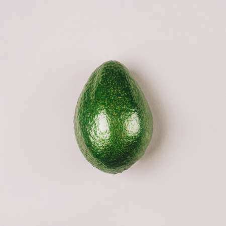 Fresh green avocado on a grey background. Top view.の写真素材
