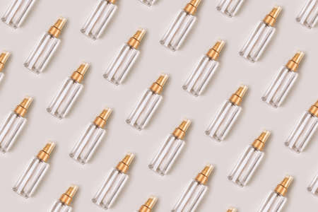 Pattern of bottles with a cosmetic product for skin or hair care. Flat lay, top view.の写真素材