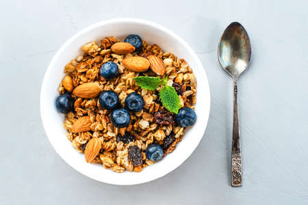 Baked granola with blueberries on a gray table. Top view.の写真素材