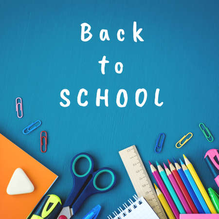 School supplies on blue background. Top view. Copy space.の写真素材