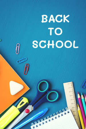 School supplies on blue background. Top view. Copy space.の写真素材