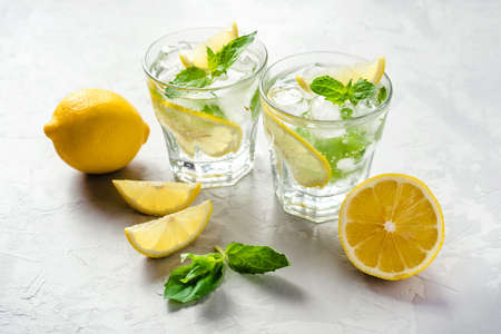 Cold refreshing lemonade or mojito with ice and mint leaves.の写真素材