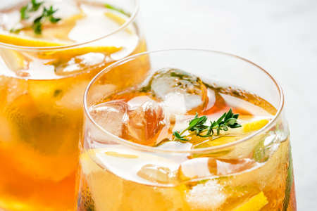 Iced tea with ice, mint and lemon. Refreshment cold summer drink. Close up shot.の写真素材