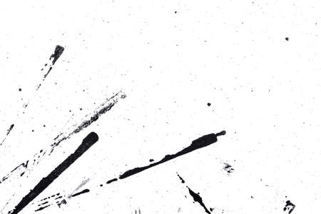 Abstract drops and smears of black acrylic paint isolated on a white background.の写真素材