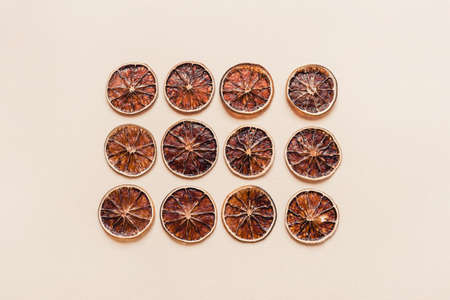 Dried lime slices. A natural snack. Pastel background. Flat lay, top view.の写真素材