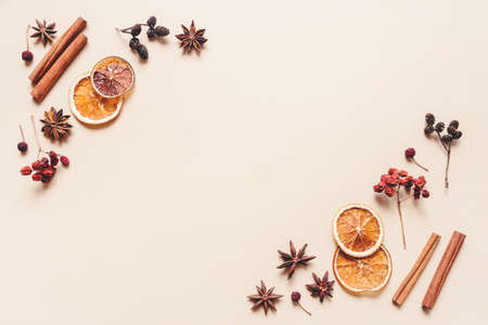 Autumn pastel background made of oranges, berries and spices. Flat lay, top view. Copy space for text.の写真素材