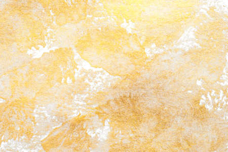 Aged texture created with gold acrylic paint. Festive background.の写真素材