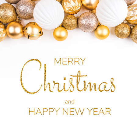 Festive white background with gold Christmas decorations. Flat lay, top view.の写真素材