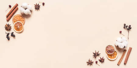 Autumn pastel background made of oranges, berries and spices. Flat lay, top view. Copy space for text.の写真素材