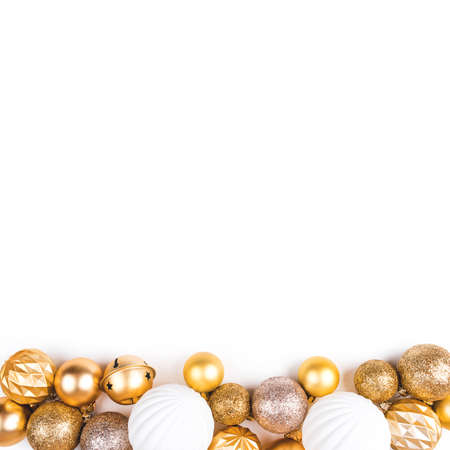 Festive white background with gold Christmas decorations. Flat lay, top view.の写真素材