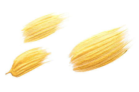 Gold acrylic brushstroke isolated on a white background.の写真素材