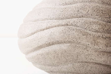 Beige background made of clay bowl with wave pattern. Natural texture.の写真素材