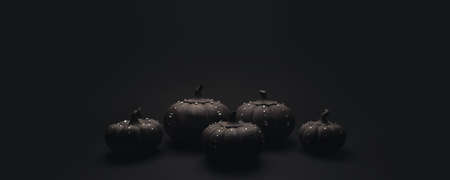 Ceramic pumpkins with rhinestones on a black background. Minimalistic background for autumn holidays with space for text.の写真素材