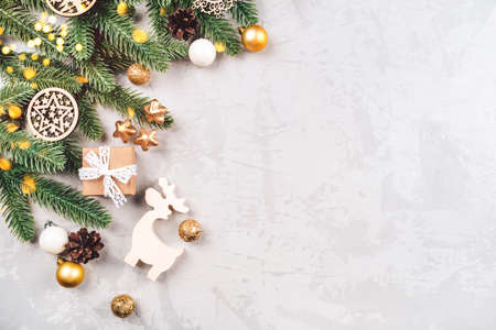 Christmas background of fir tree branches and decorations. The concept of the winter holidays. Flat lay, top view, copy space.の写真素材
