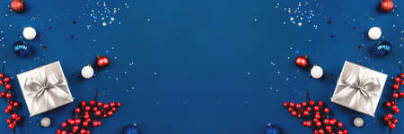 Blue Christmas background of gift box and decorations. The concept of the winter holidays. Flat lay, top view, copy space.の写真素材