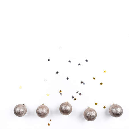 Festive white background with gold Christmas decorations. Flat lay, top view. Copy space for text.の写真素材