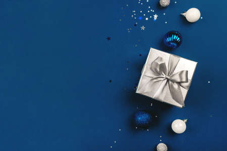Blue Christmas background of gift box and decorations. The concept of the winter holidays. Flat lay, top view, copy space.の写真素材